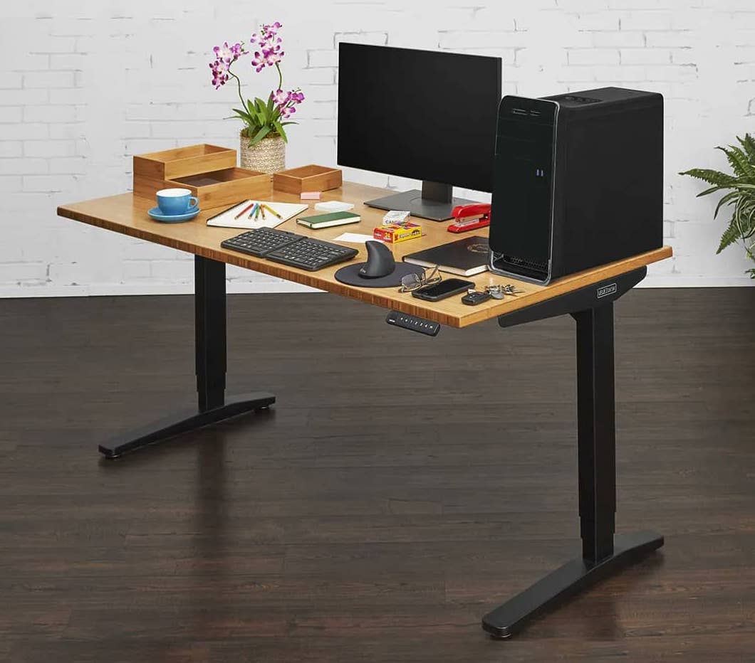 uplift desk v2 bamboo standing desk for small spaces